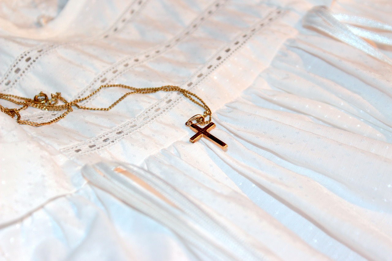 gold necklace with a cross pendant
